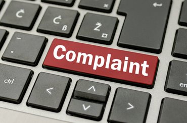 Complaint button on a computer keyboard.
