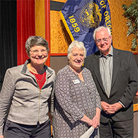 Treasurer Steiner next standing next to a man and a woman.